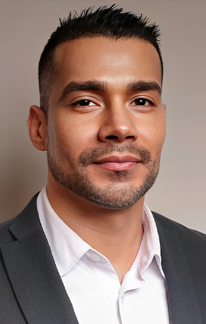 Man in suit smiling at camera.