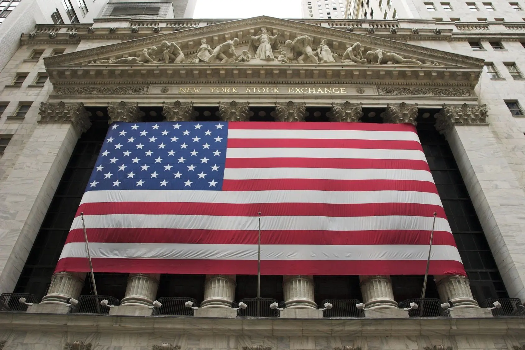 American flag draped over New York Stock Exchange.